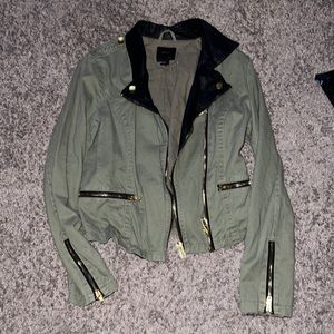 Green jean jacket with leather detail